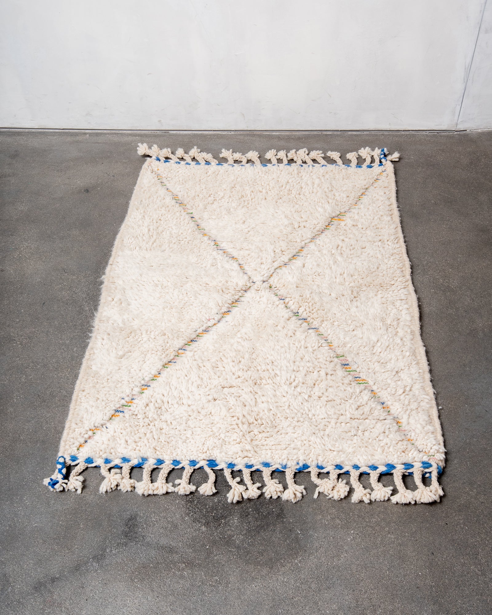Modern, designer, handcrafted Berber rug from Morocco. Beniourain carpet with beautiful colours and patterns and fluffy wool texture.